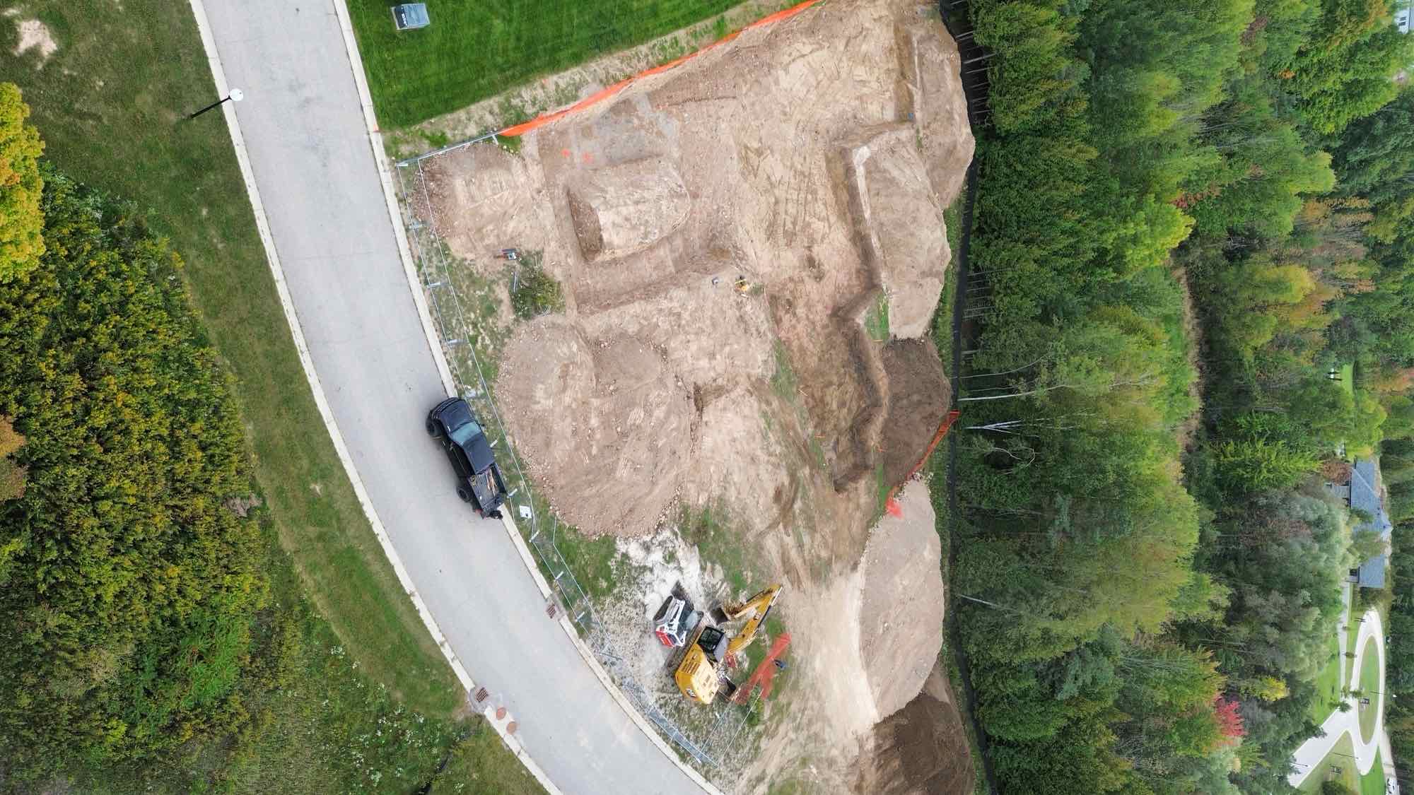 Country Estates Construction demolition: excavator clearing the last of a demolished house