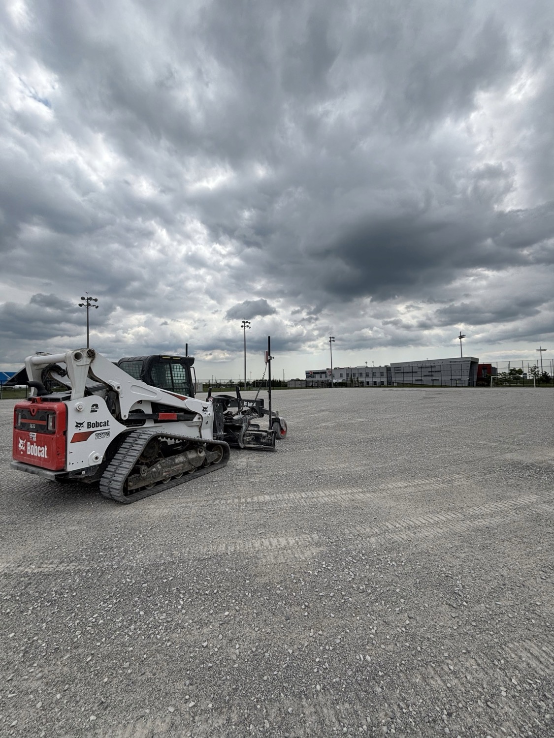 Bobcat grader on a large lot