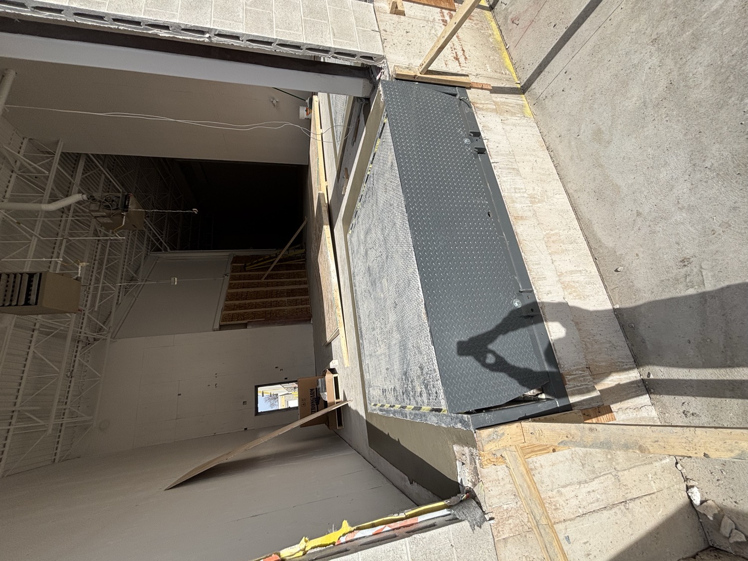 Concrete pad at a building entrance