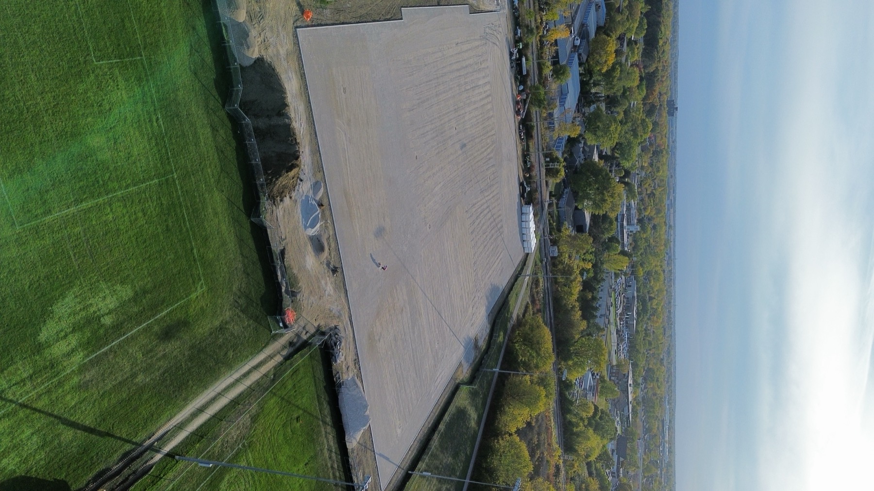 Aerial of graded field with equipment