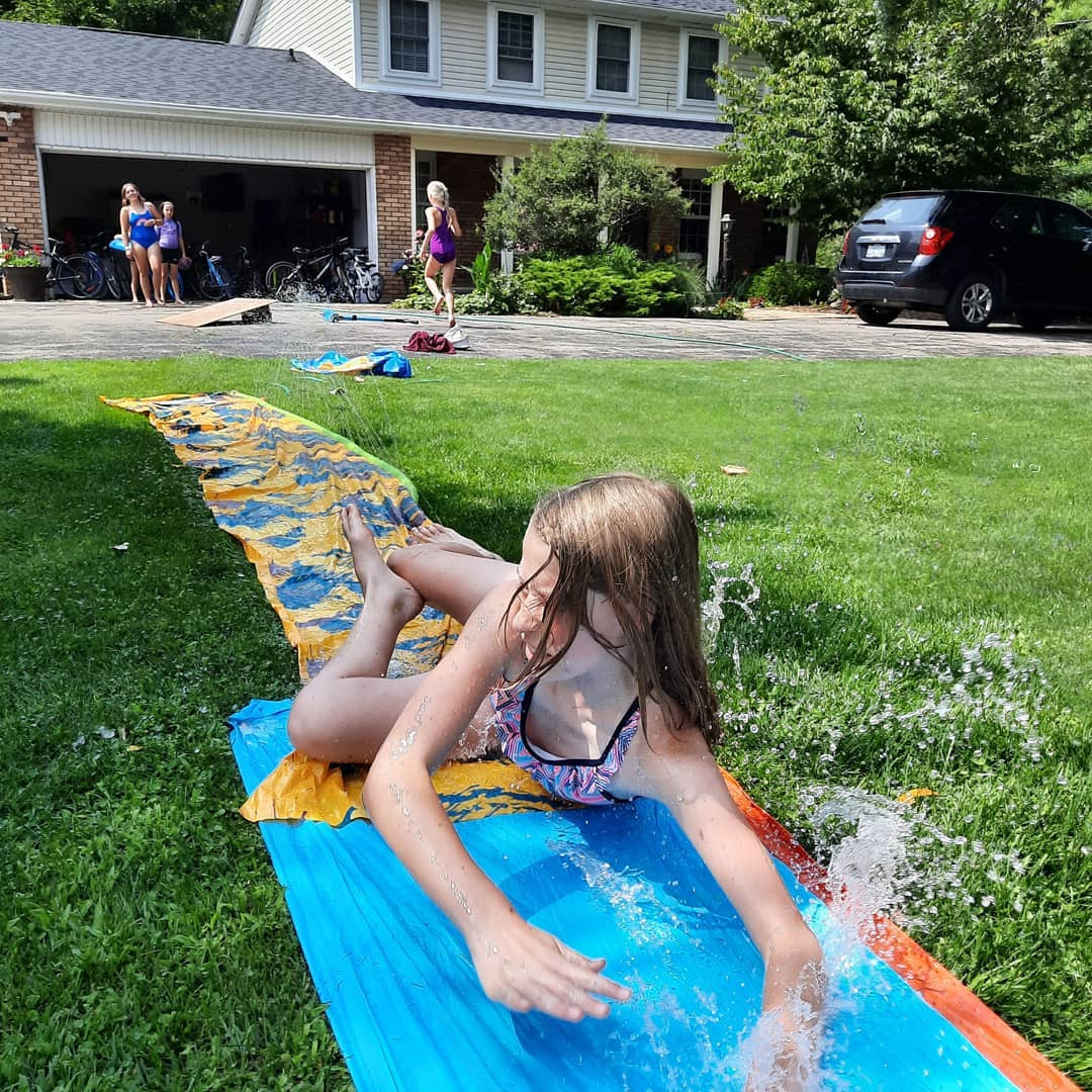 A camper on a water slide