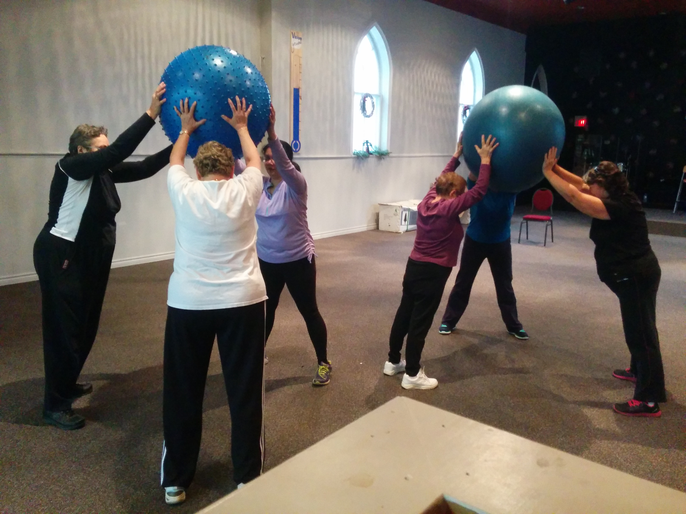 A group class with exercise balls