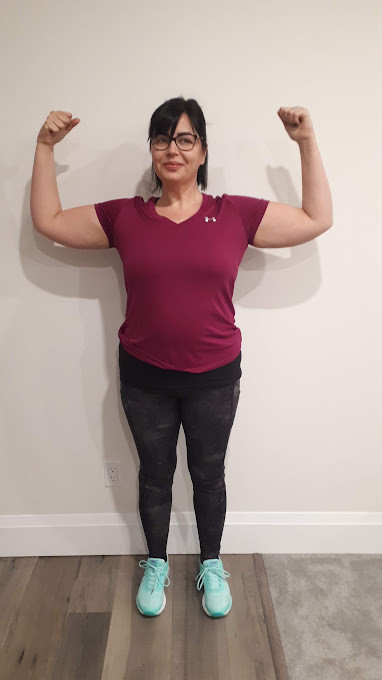 A client flexing after a session