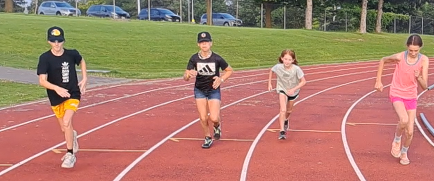 Two young sprinters on a running track