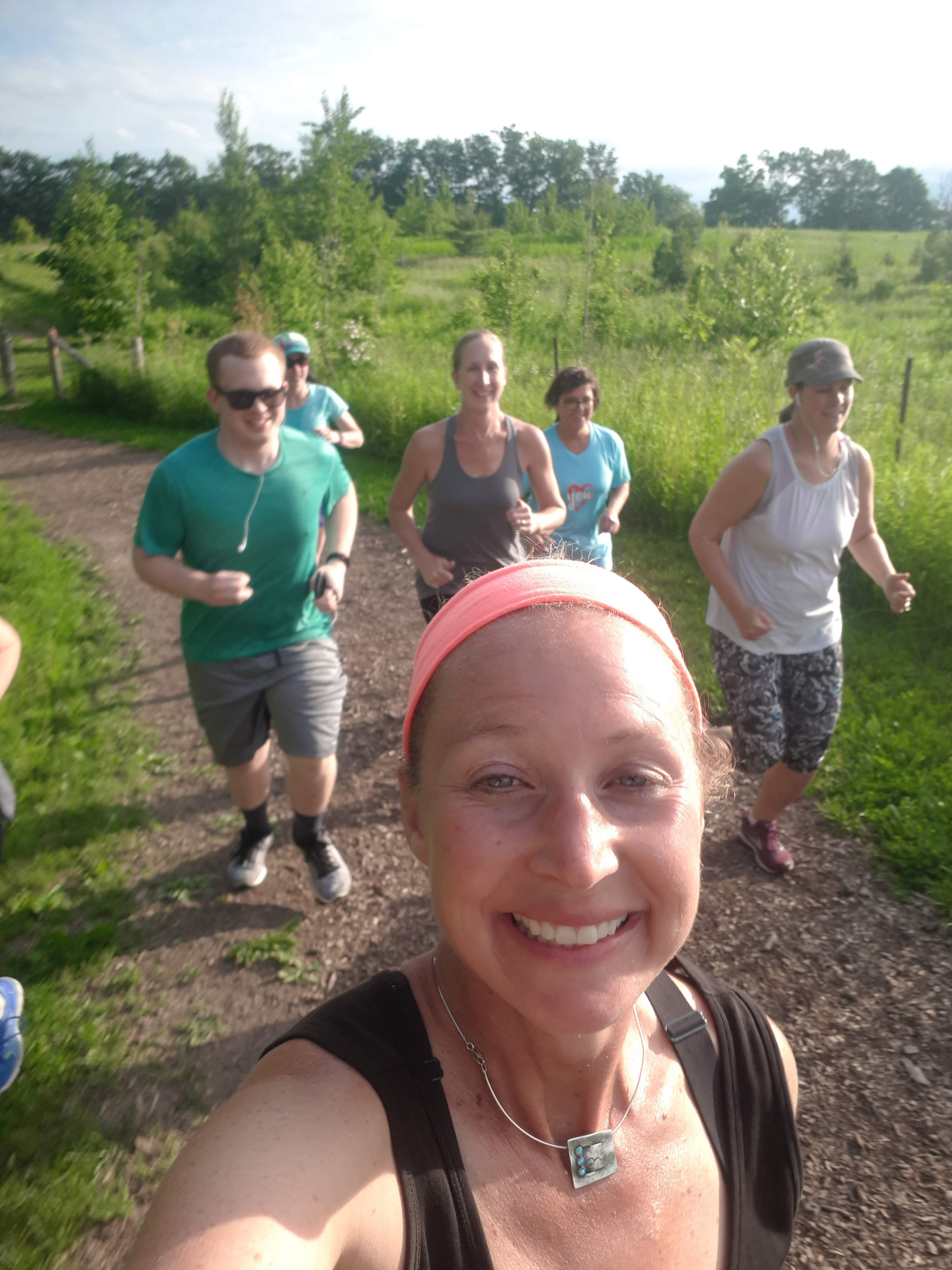 Kaley on a walk with a group in a field