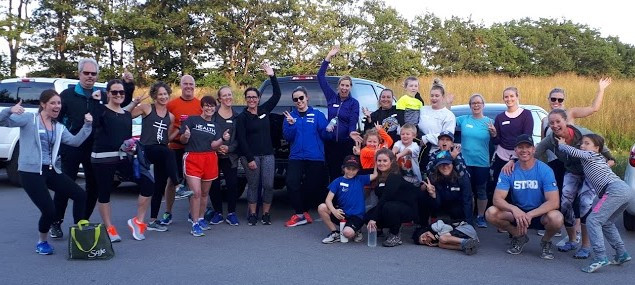 A large running group after a class
