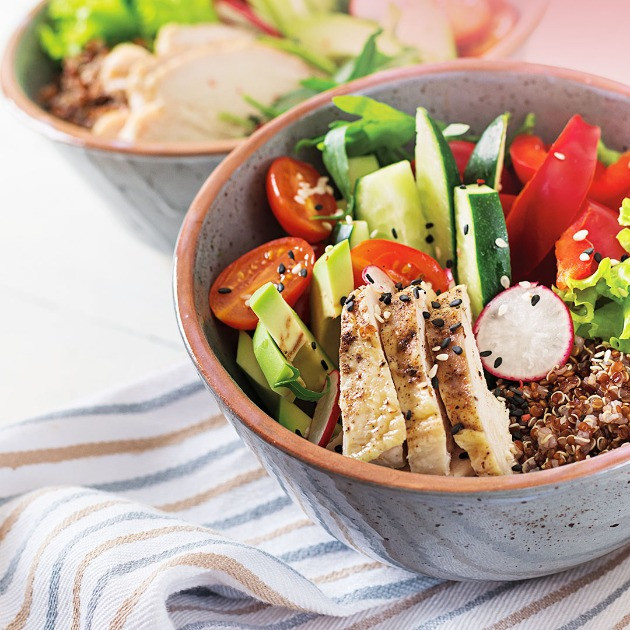 A bowl of salad with grilled chicken