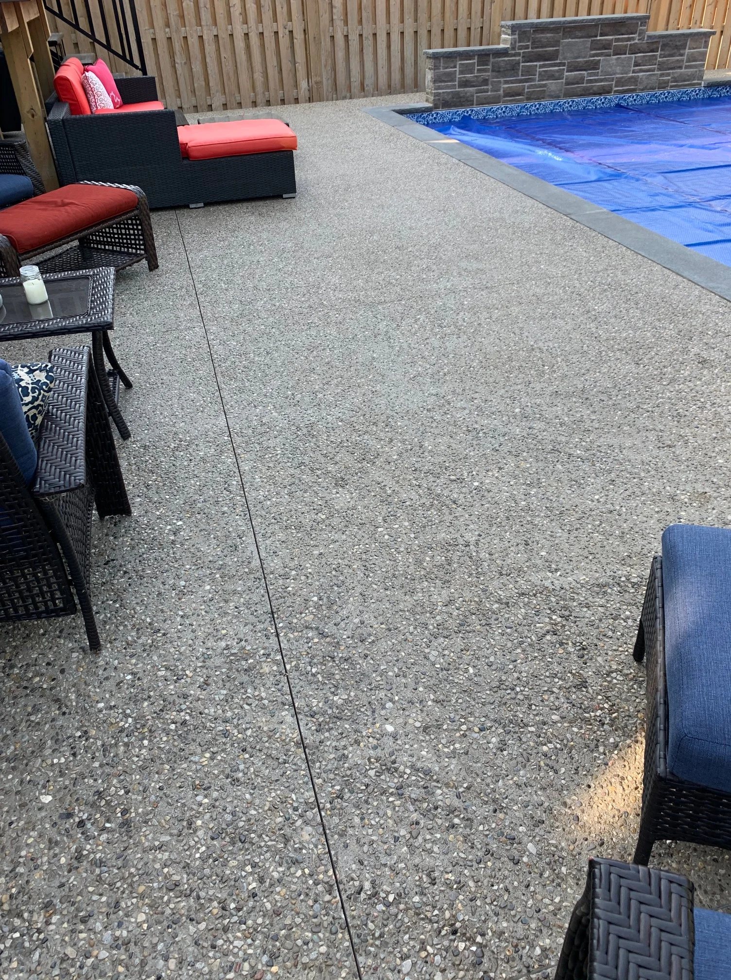 Exposed aggregate concrete pool deck