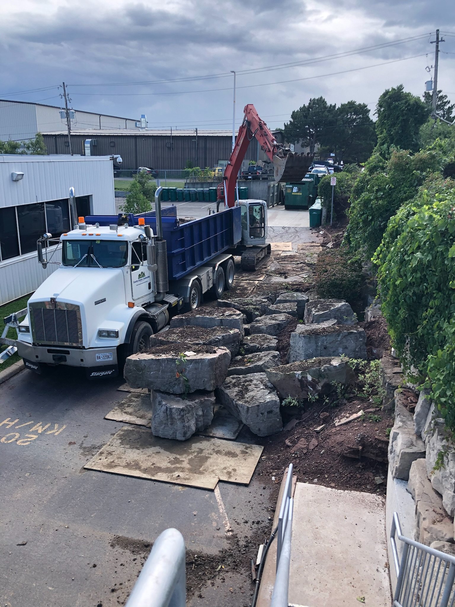 Dump truck and large armour stones on a job