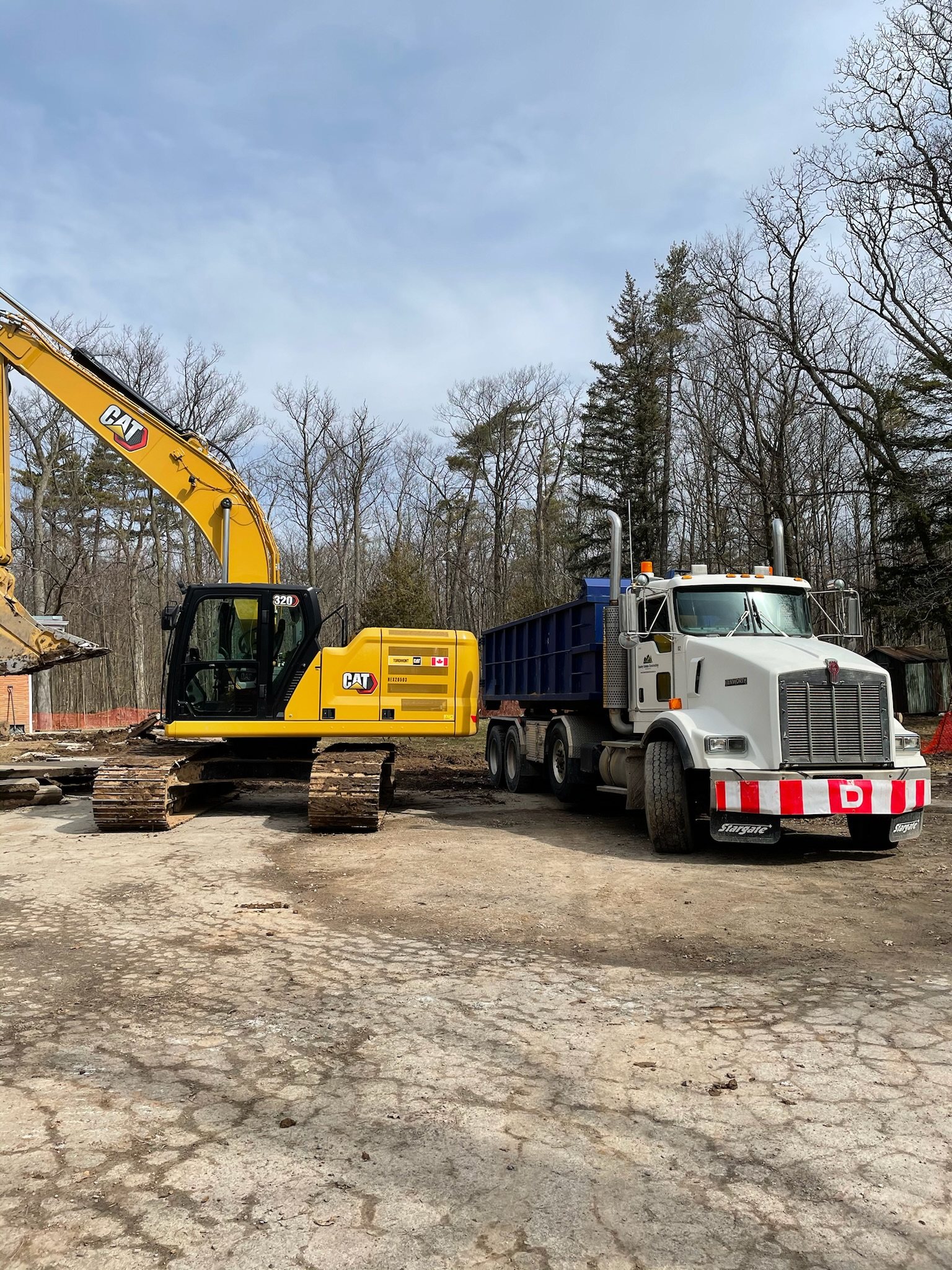 Excavator and dump truck at work on a site