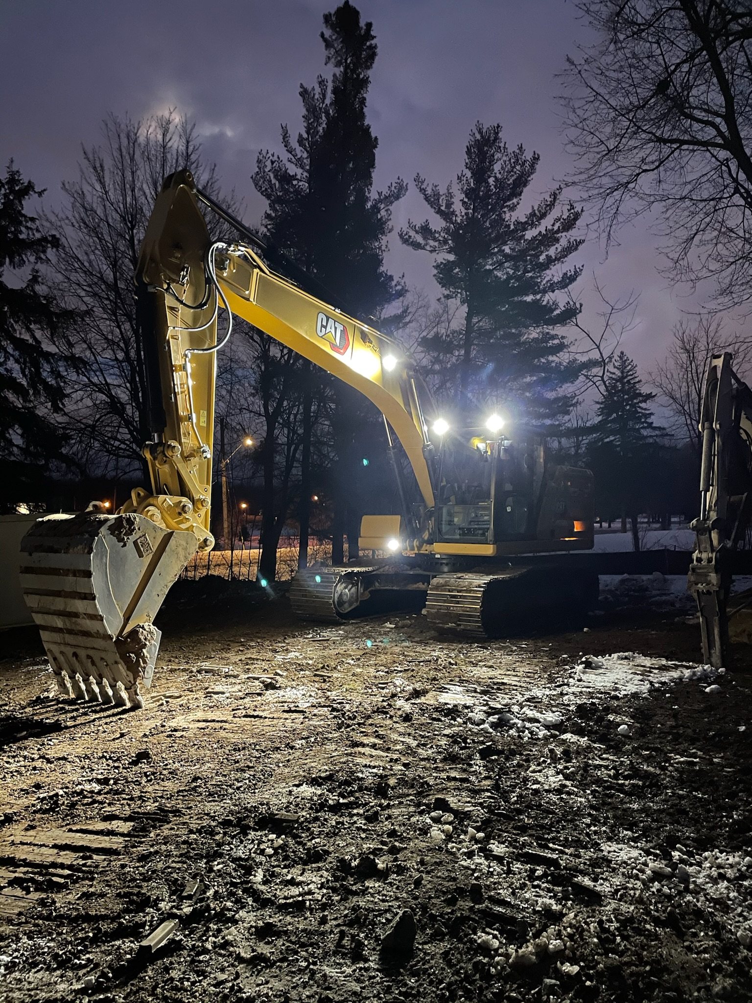 Excavator working at night under its lights