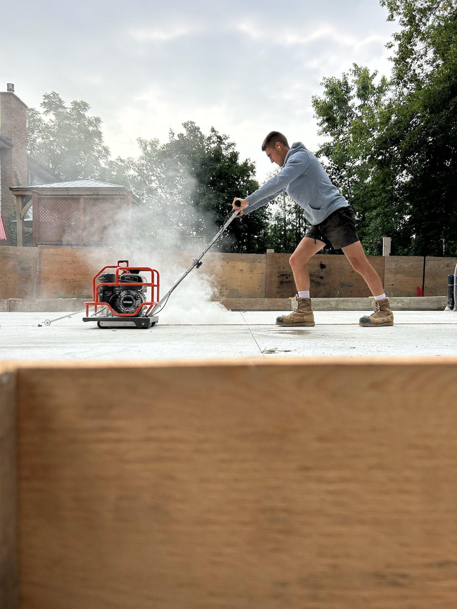 Power washing a freshly poured exposed aggregate surface