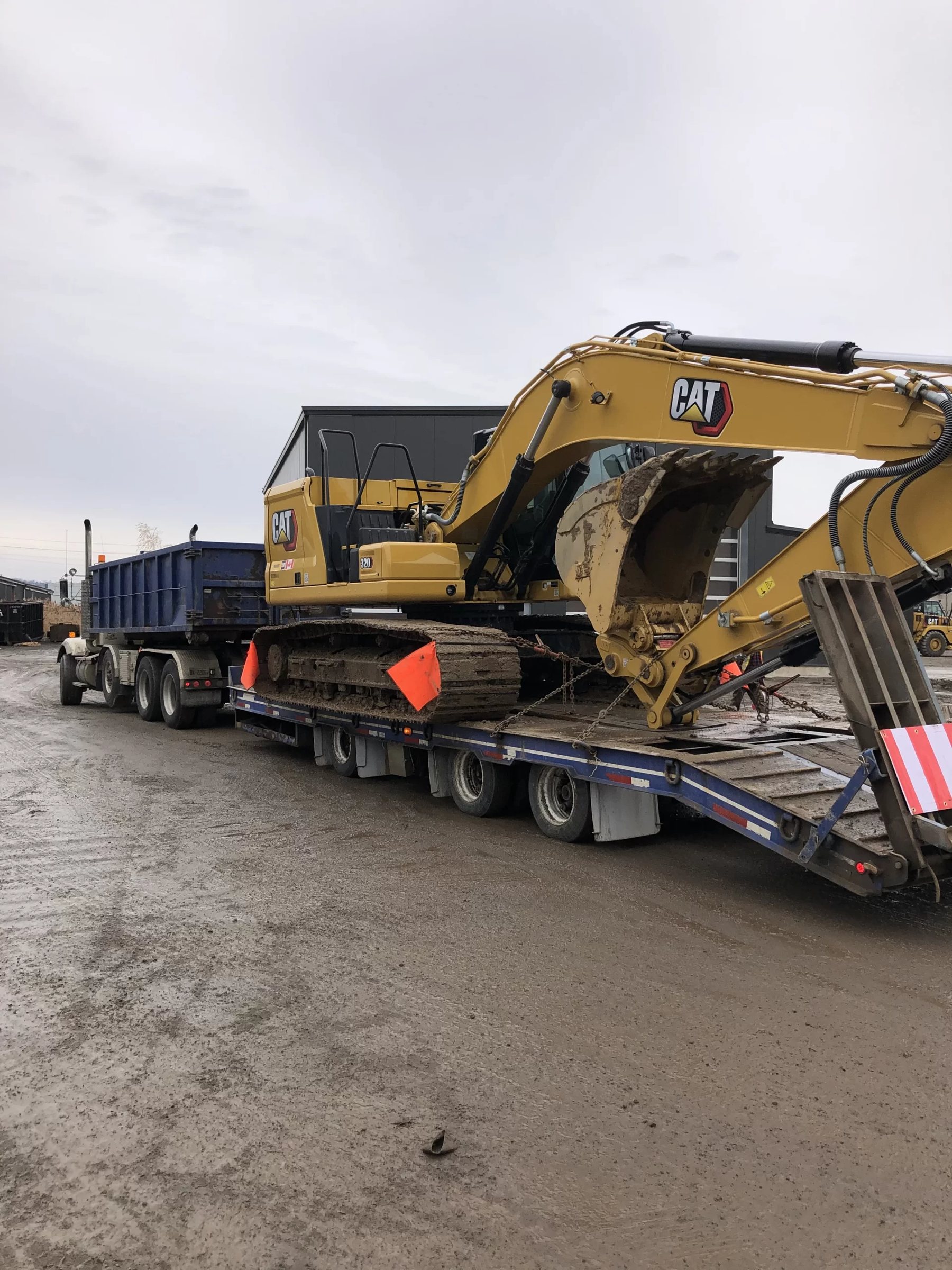 Excavator loaded on a float trailer