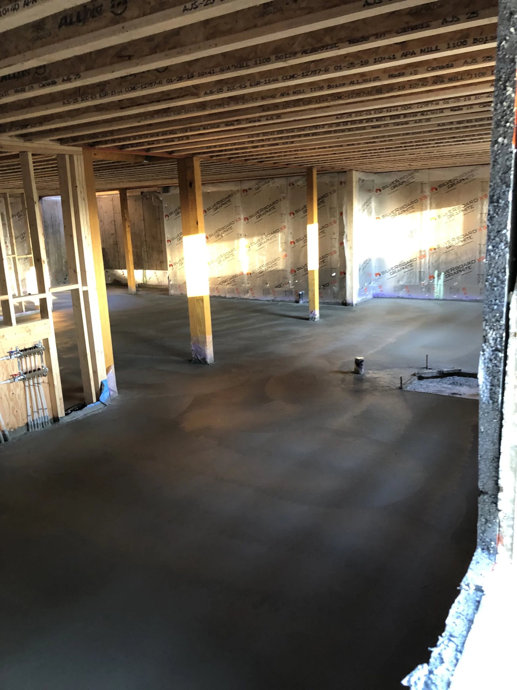 New concrete basement floor in a house under construction